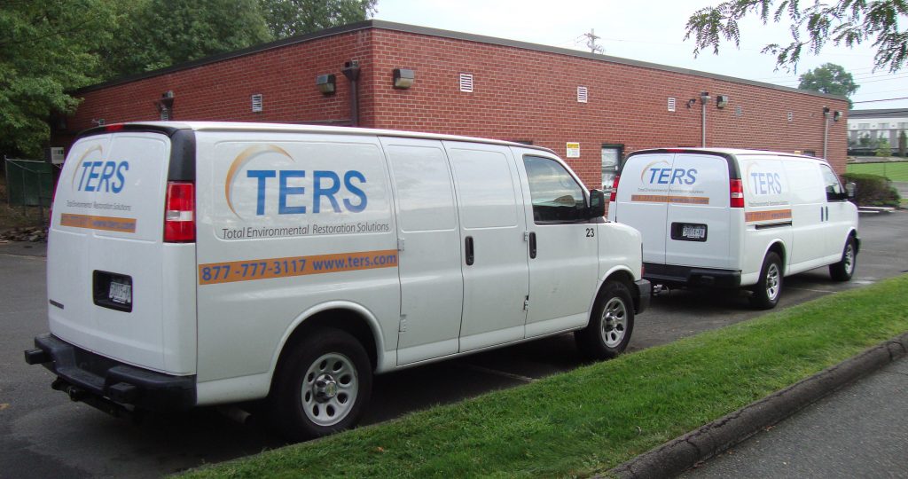 TERS emergency restoration response vans parked near a commercial building in New Jersey