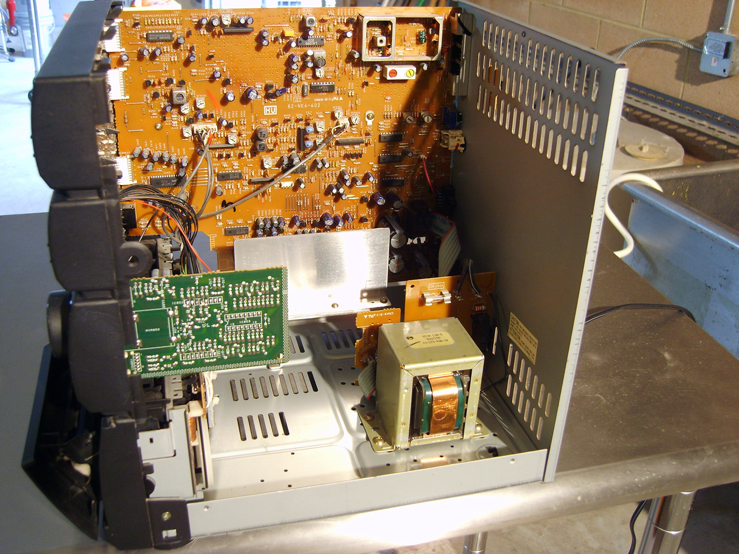 Open computer tower with exposed interior components cleaned by TERS, Inc.