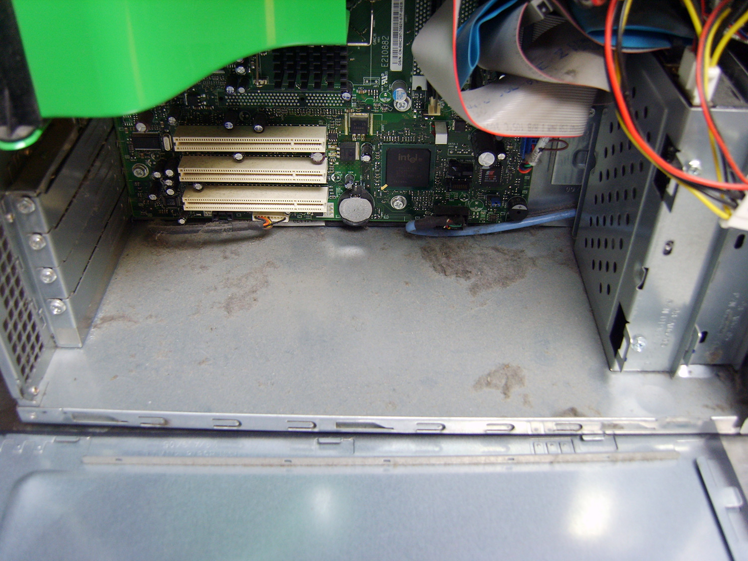 Dirty wiring and electronic components inside an open computer tower