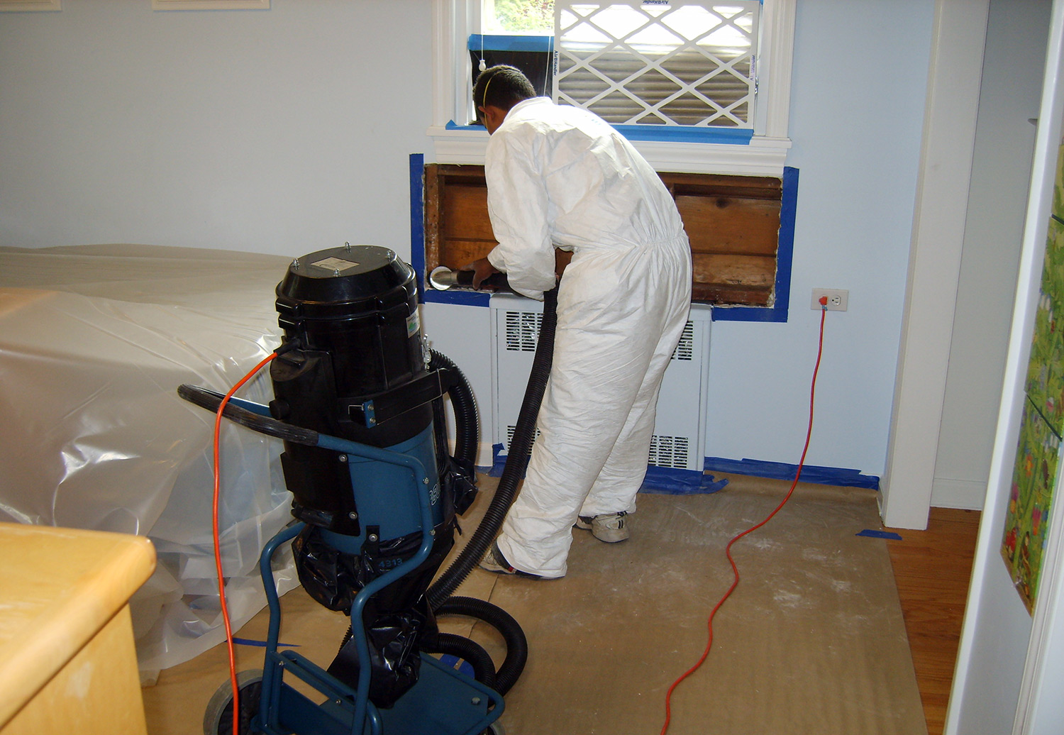 TERS water damage restoration expert decontaminating mold and moisture below the leaking window
